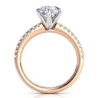A rose gold diamond engagement ring with a large round-cut center stone and a pavé band set with small round diamonds, shown on a clean white background.