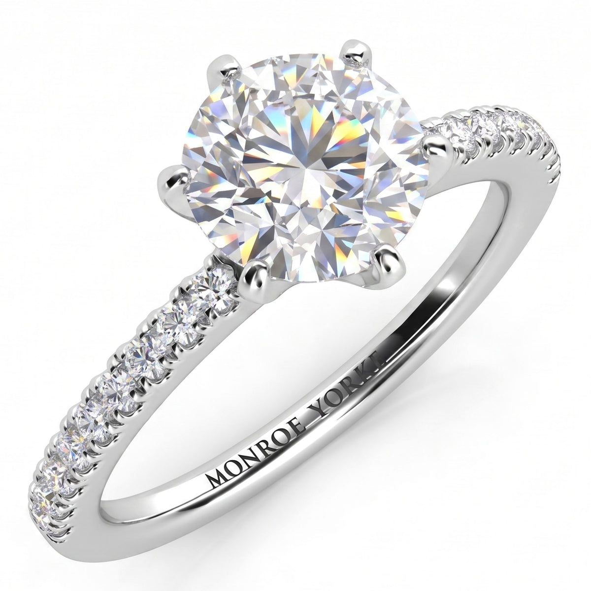 June - Six claw diamond ring. Diamond engagement ring with side diamonds. Centre diamond in a six claw setting. White gold or platinum