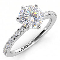 June - Six claw diamond ring. Diamond engagement ring with side diamonds. Centre diamond in a six claw setting. White gold or platinum