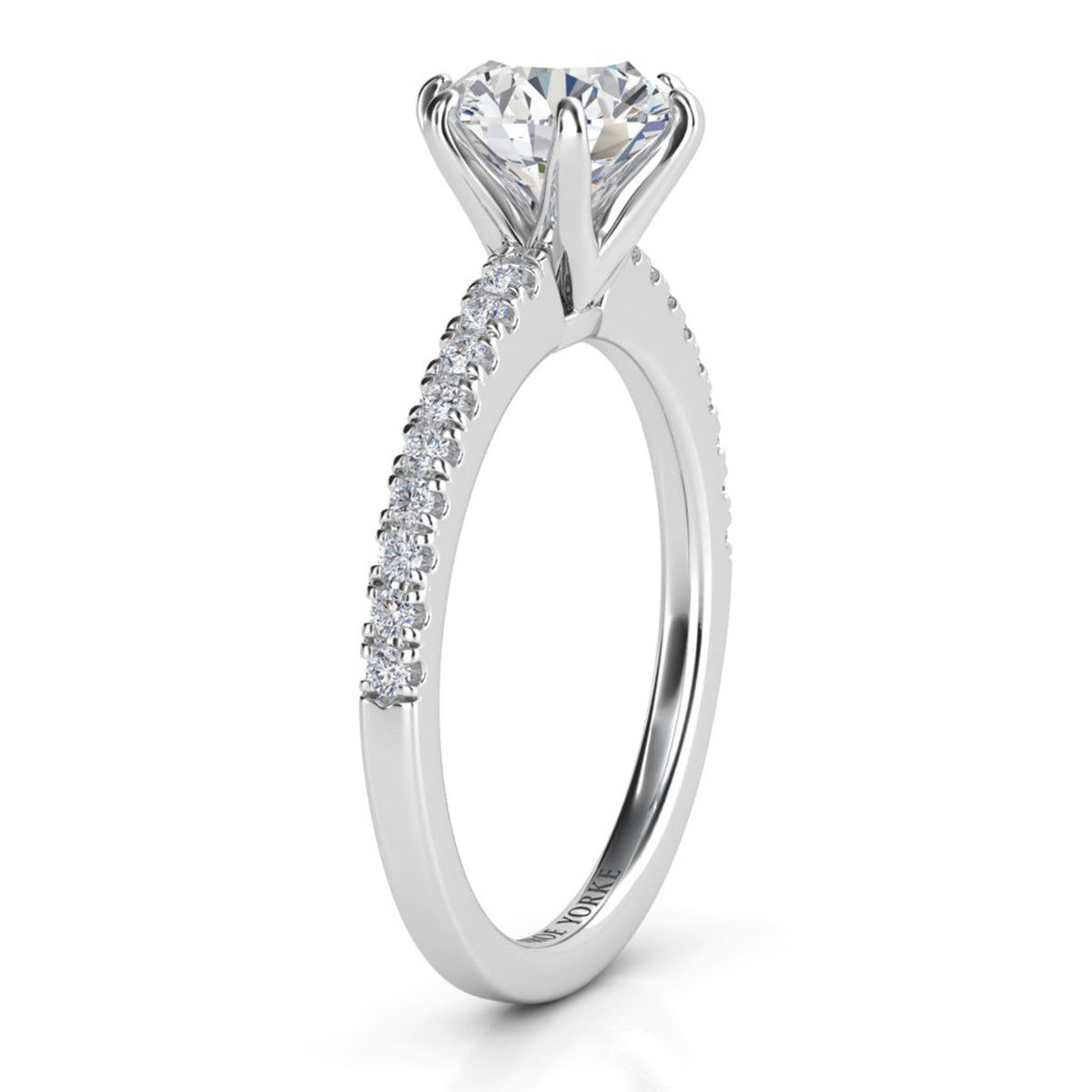 June - Side view.  Centre round diamond in a six claw setting.  