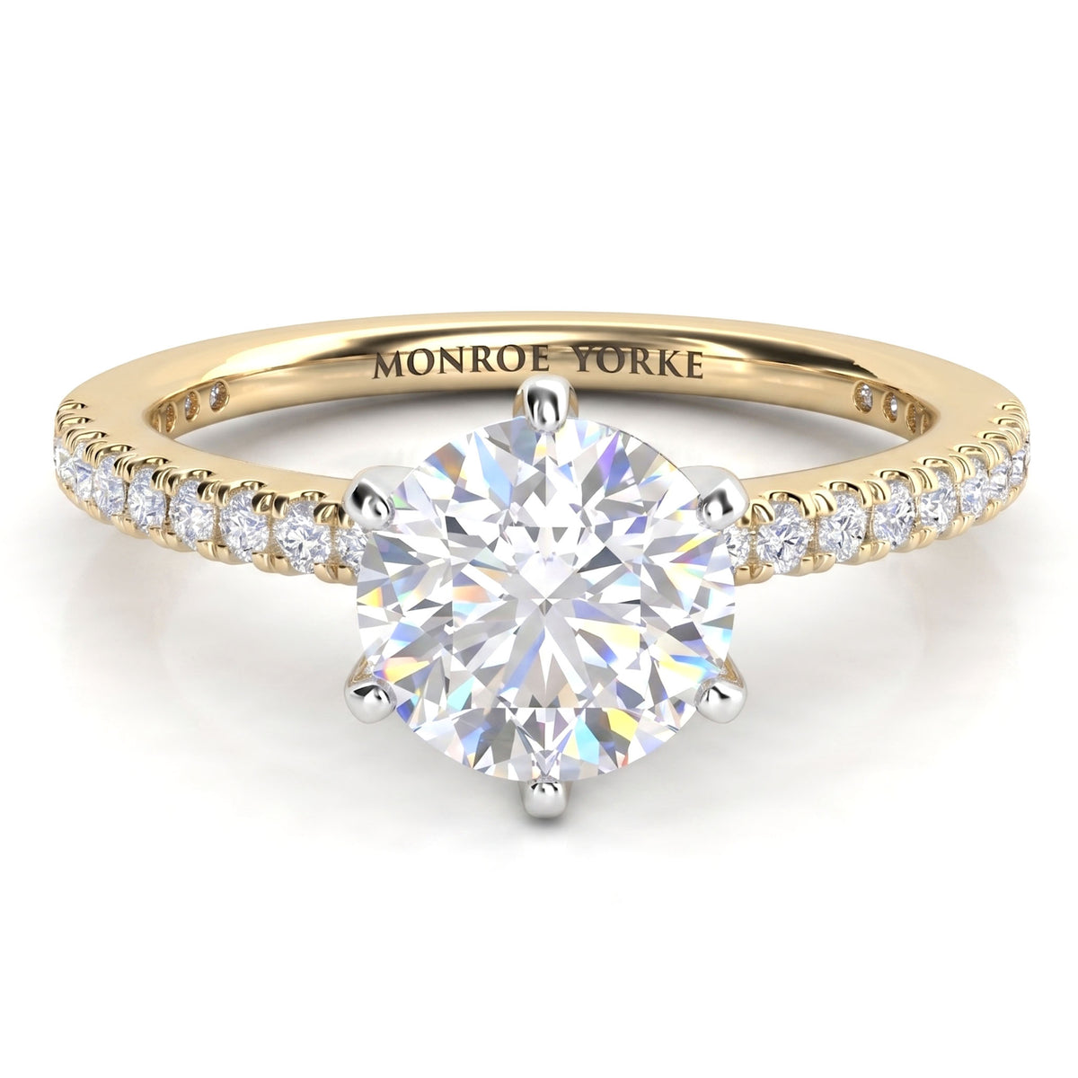 June - Yellow gold six claw diamond engagement ring with a round brilliant centre diamond and diamonds set along the band.
