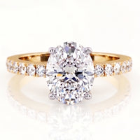 Kendall Yellow Gold - gold oval cut diamond engagement ring with diamonds on the band.  Centre diamond low setting