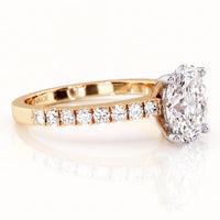 Kendall - yellow gold diamond engagement ring with an oval shaped centre diamond and diamonds on the band
