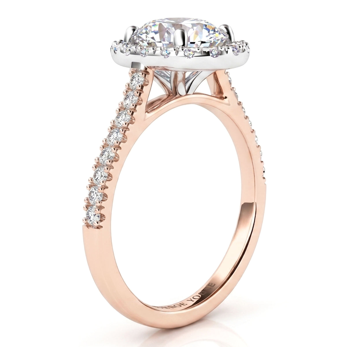 A rose gold diamond ring with a halo and pavé-set diamond shank, showing side view