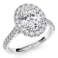 Oval Cut Diamond Ring with a Diamond Halo, created in white gold or platinum