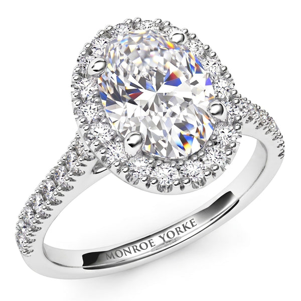 Oval Cut Diamond Ring with a Diamond Halo, created in white gold or platinum