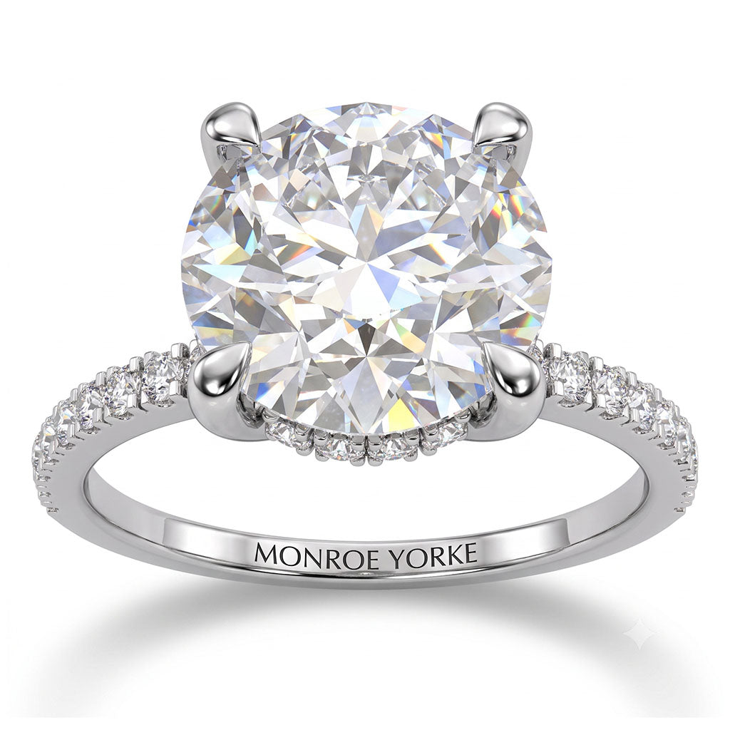 Liliana in white gold, side view showing the hidden halo beneath the centre diamond
