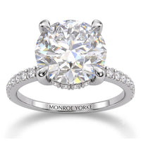 Liliana in white gold, side view showing the hidden halo beneath the centre diamond
