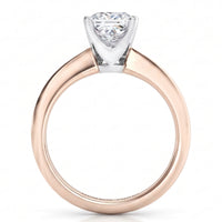 A rose gold solitaire engagement ring with a princess cut diamond set in a white metal prong, shown on a clean white background.