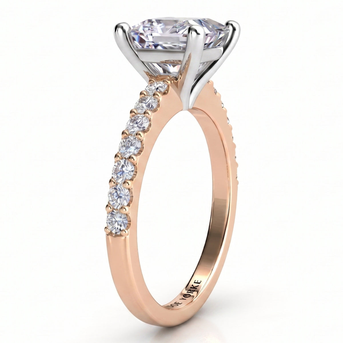 Lutèce rose gold engagement ring, side profile showing the four claw setting, the white metal setting head and the micro claw set shoulders.