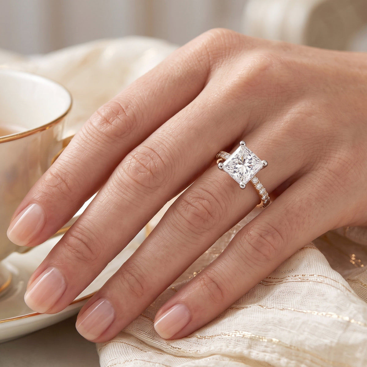 Lutece - princess cut diamond engagement ring on a hand. Rose gold
