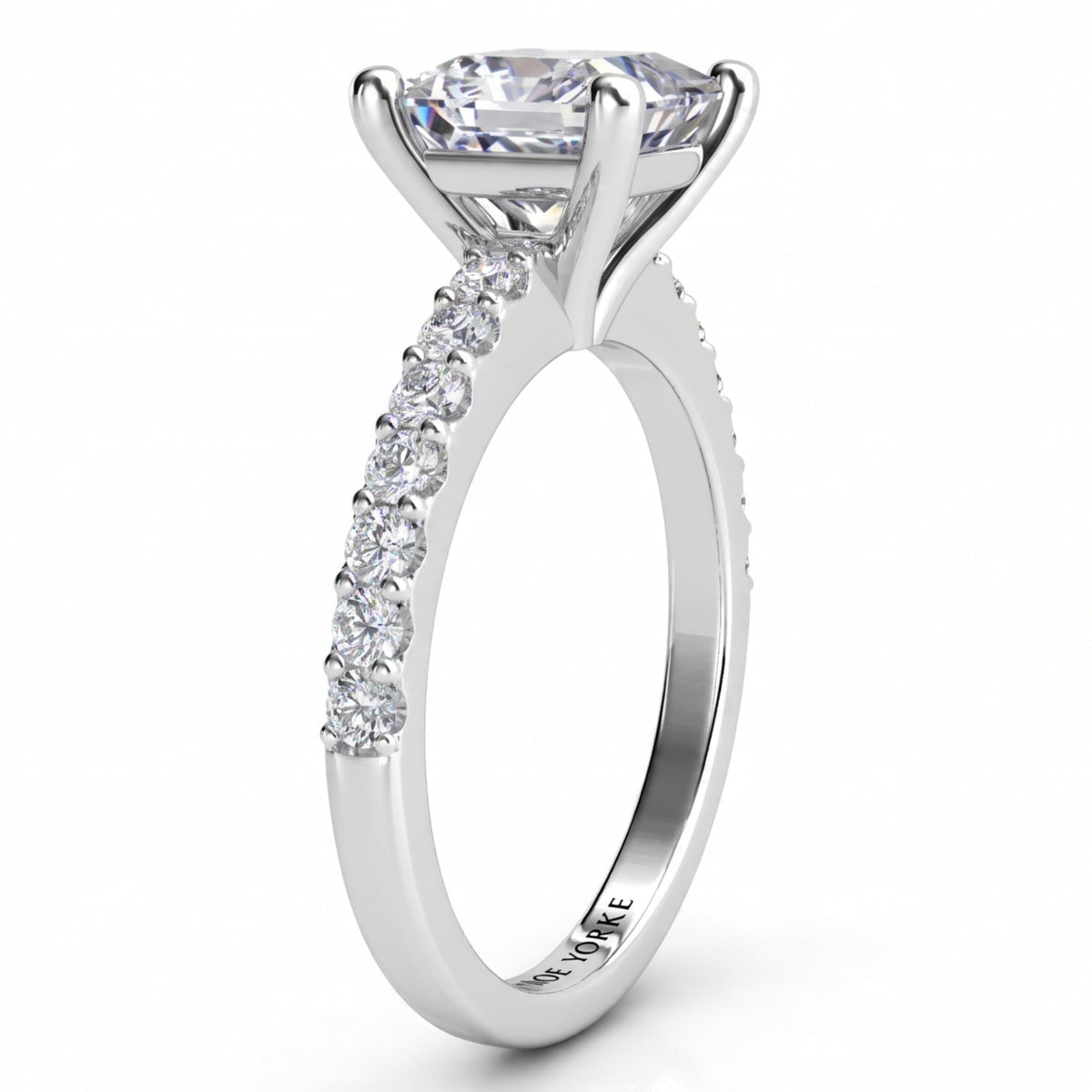Lutèce engagement ring in white gold or platinum, side profile showing the four claw setting and the micro claw set shoulders.