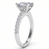 Lutèce engagement ring in white gold or platinum, side profile showing the four claw setting and the micro claw set shoulders.