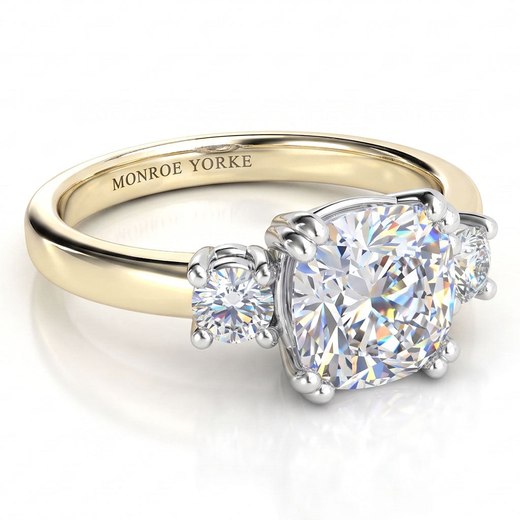 Meghan - Three diamond ring. Centre Cushion diamond and rounds on sides. Yellow Gold
