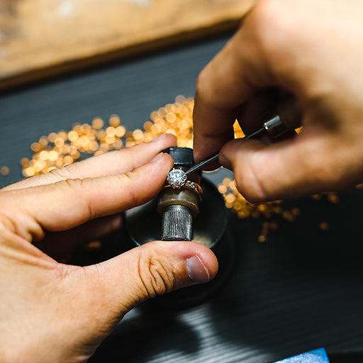 A Master Jeweller at Monroe Yorke Diamonds setting diamonds into an engagement ring.  Created to a very high standard to provide a lifetime guarantee on our workmanship. 