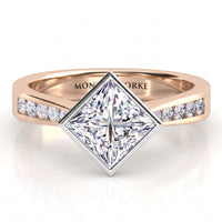 Nash - Rose gold princess cut diamond engagement ring with channel set diamonds along the shoulders.