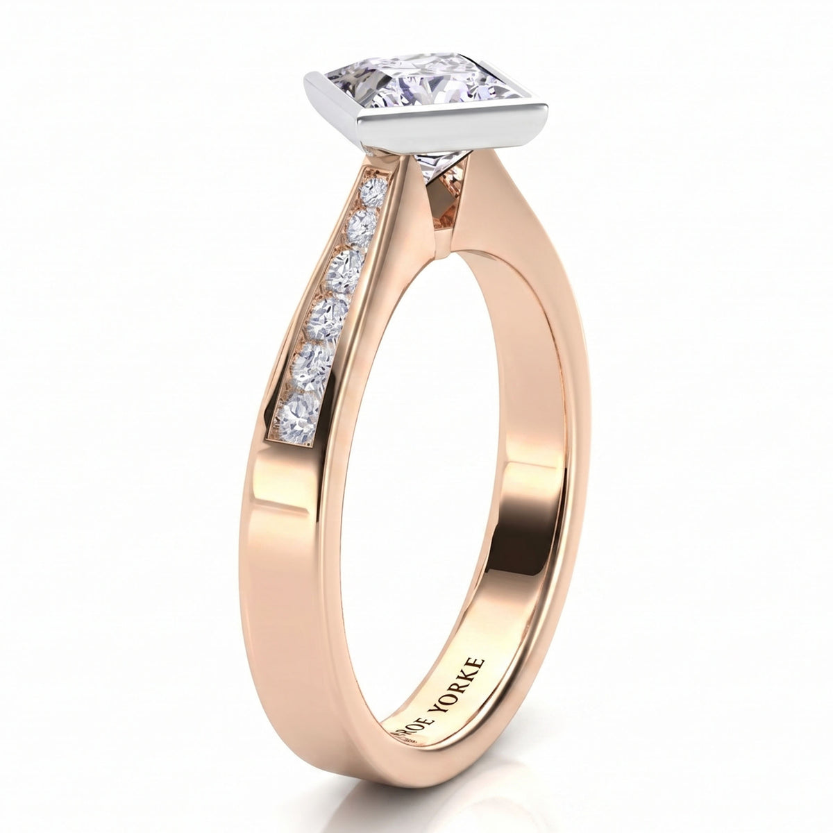 Nash - Rose gold princess cut diamond engagement ring, side view showing the channel set band.