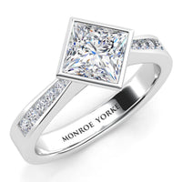 Nash - Rub-over Bezel Set Princess Cut Diamond Engagement Ring. Centre diamond set at a 45 degree angle. White gold or Platinum.