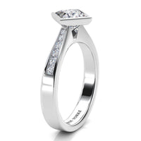 Nash diamond ring, side view showing channel set diamonds on the shoulder. White gold or Platinum.