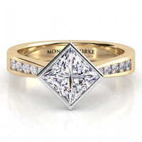 Nash - Yellow gold princess cut diamond engagement ring, centre diamond bezel set at a 45 degree angle.