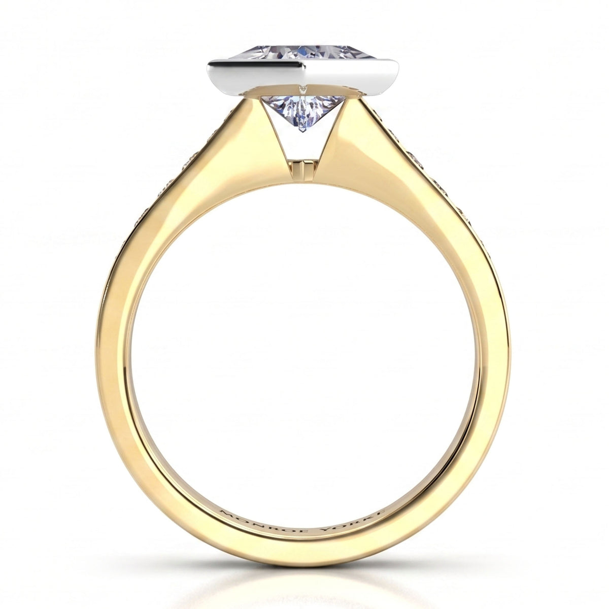Nash - Yellow gold ring with the princess cut centre diamond held in a rub-over bezel.