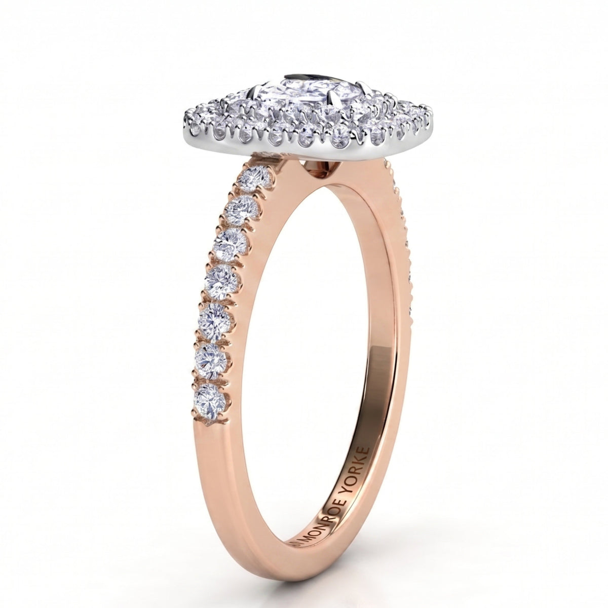 Norah double halo cushion cut ring, rose gold band with round diamonds claw set along the shoulders and a white metal setting head, profile view showing the low set halo disk.