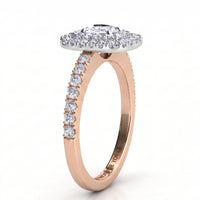 Norah double halo cushion cut ring, rose gold band with round diamonds claw set along the shoulders and a white metal setting head, profile view showing the low set halo disk.
