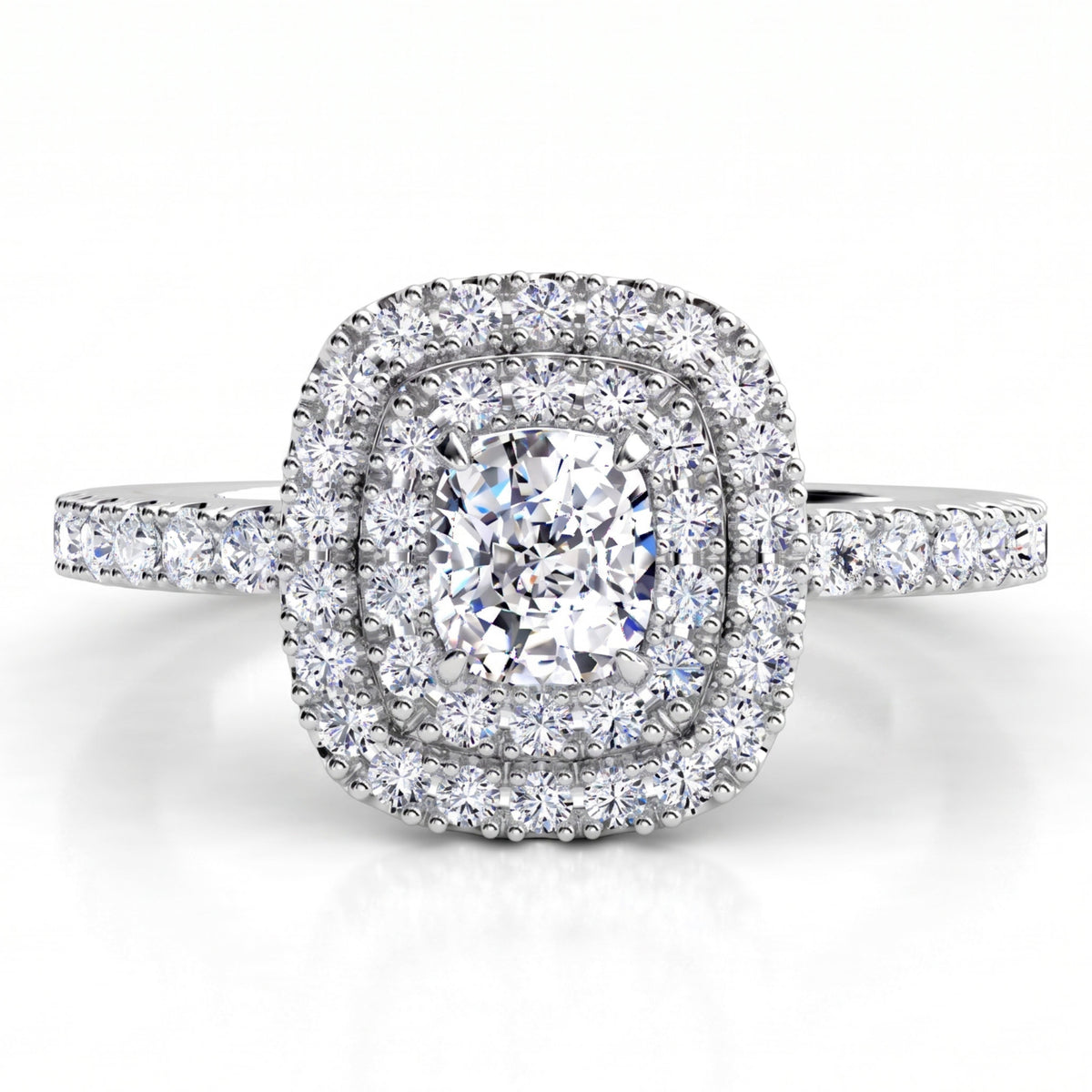 Norah double halo engagement ring in white gold or platinum, top view showing the cushion cut centre diamond ringed by an inner and outer halo of round brilliant diamonds.