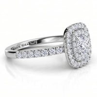 Norah cushion cut double halo engagement ring in white gold or platinum, angled side view showing the depth of the two halos and the claw set shoulders.