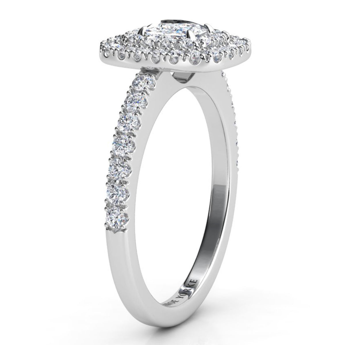 Norah double halo cushion cut ring in white gold or platinum, profile view showing the low set halo disk and the round diamonds claw set along the band.