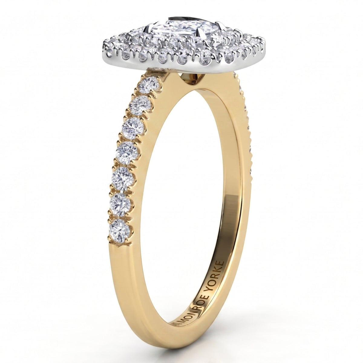 Norah double halo cushion cut ring, yellow gold band with round diamonds claw set along the shoulders and a white metal setting head, profile view showing the low set halo disk.