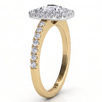 Norah double halo cushion cut ring, yellow gold band with round diamonds claw set along the shoulders and a white metal setting head, profile view showing the low set halo disk.