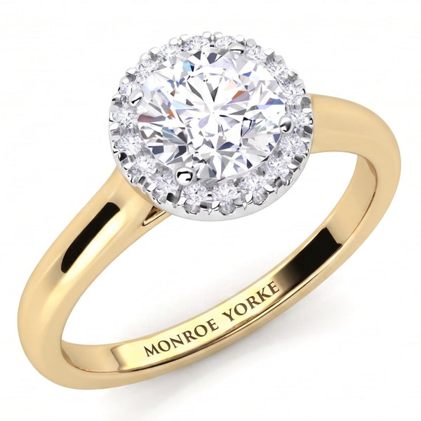 Oasis yellow gold engagement ring, round brilliant centre diamond inside a halo of micro claw set diamonds.