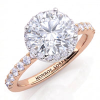 Orion rose gold engagement ring, round brilliant centre diamond with a hidden halo, Monroe Yorke engraved inside the band.