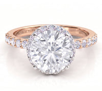 Orion rose gold engagement ring, round brilliant centre diamond above a hidden halo of smaller diamonds, with micro claw set diamonds along the band.