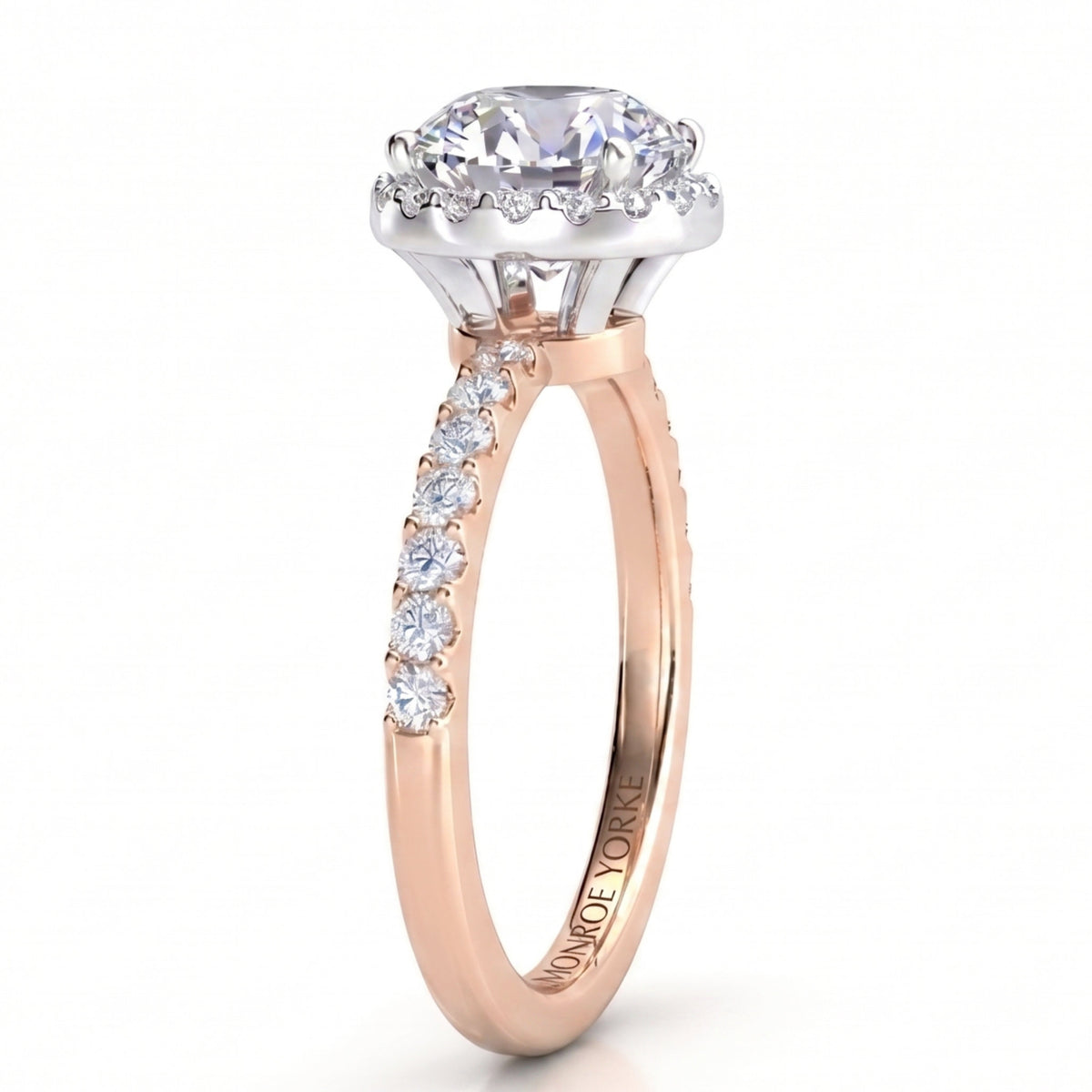 Orion rose gold engagement ring, round centre diamond in a hidden halo setting with a micro claw set band.