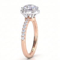 Orion rose gold engagement ring, round centre diamond in a hidden halo setting with a micro claw set band.