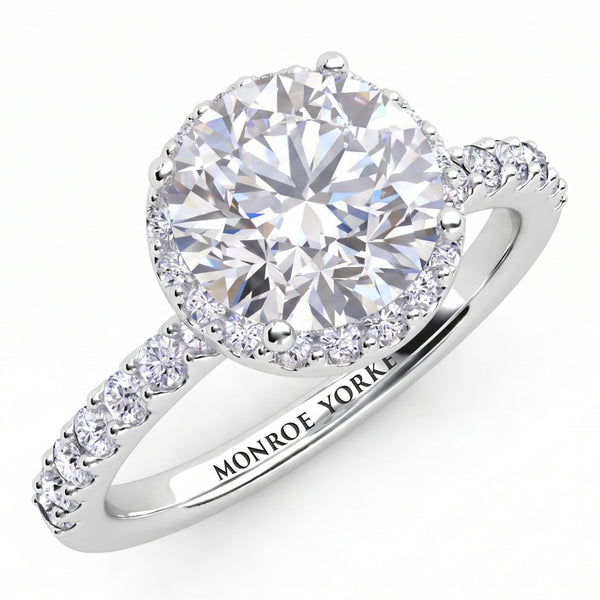 Orion engagement ring in white gold or platinum, top view of the round centre diamond and the diamond set band.