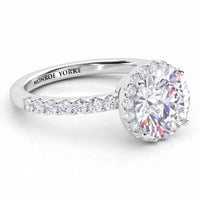 Orion engagement ring in white gold or platinum, hidden halo set under the girdle of the centre diamond.