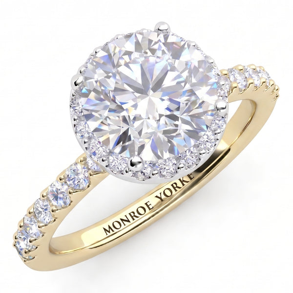 Orion yellow gold engagement ring, round centre diamond with a hidden halo beneath the girdle and micro claw set diamonds along the shank, Monroe Yorke engraved inside the band.