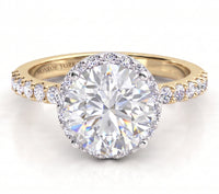 Orion yellow gold engagement ring, round centre diamond above a hidden halo of smaller diamonds, with micro claw set diamonds along the band.