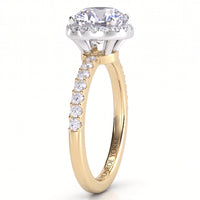 Orion yellow gold engagement ring, side view showing the hidden halo tucked under the centre diamond and five diamonds along each shoulder.
