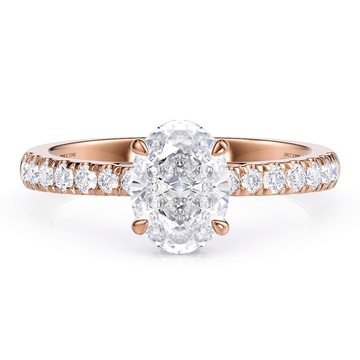 Paige hidden halo engagement ring in rose gold, side view showing the halo beneath the centre stone