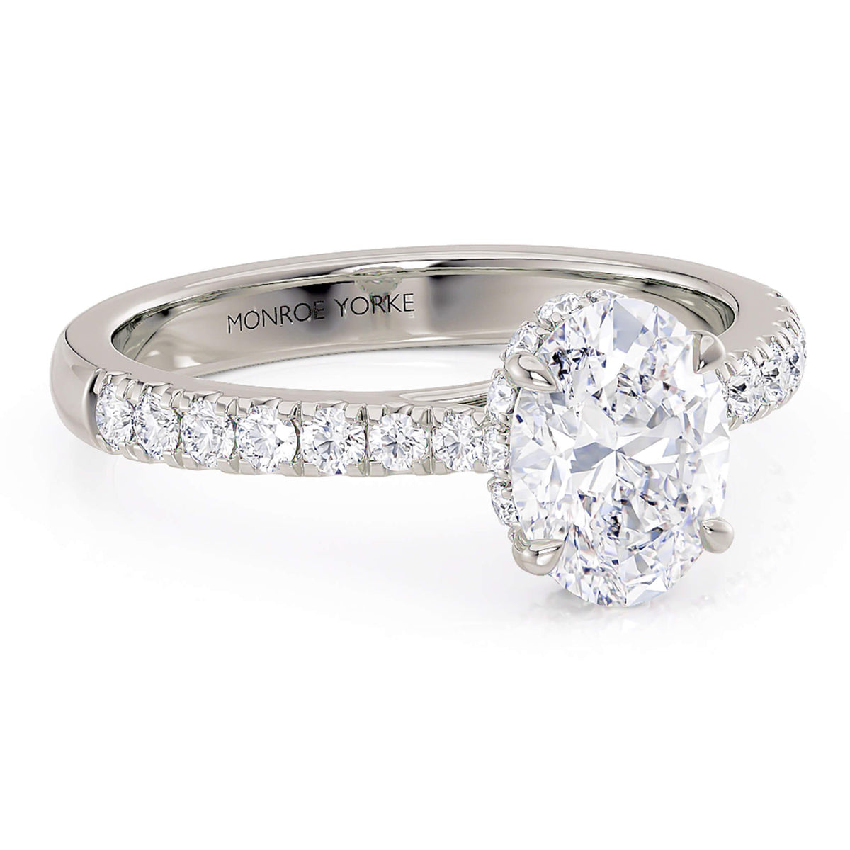 Paige hidden halo engagement ring in white gold, angled view of the pave band