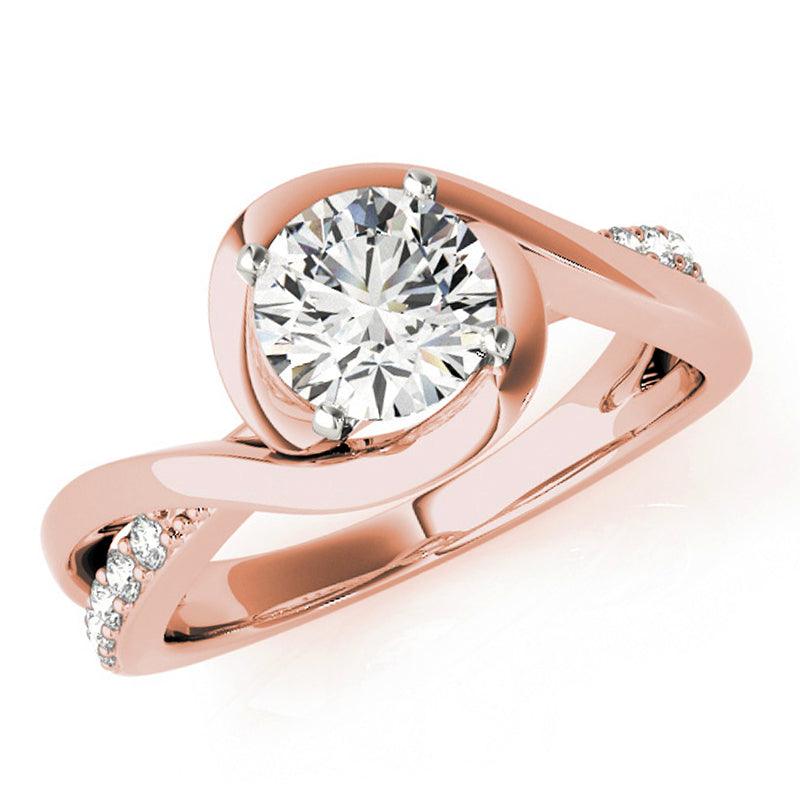 Piper wrap engagement ring in rose gold, front view showing the band crossing over itself around the centre diamond. Rose gold