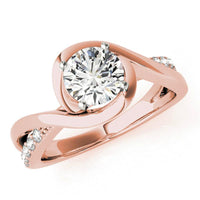 Piper wrap engagement ring in rose gold, front view showing the band crossing over itself around the centre diamond. Rose gold
