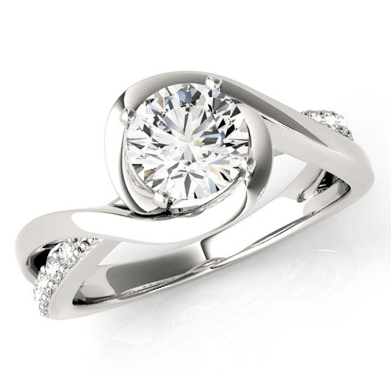 Piper wrap engagement ring in white gold, front view showing the band crossing over itself around the centre diamond. White gold or platinum