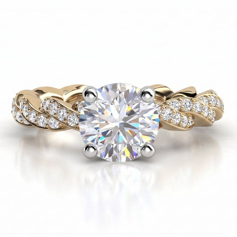 Quinn engagement ring in yellow gold. Round brilliant centre diamond above a braided pave-set band.