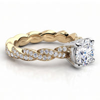 Quinn engagement ring in yellow gold, showing the twist of gold against the pave diamonds.