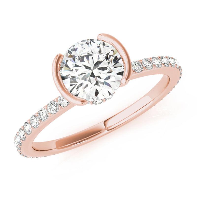Riley half rub-over engagement ring in rose gold, showing the two ends of the band closing over the sides of the round diamond
